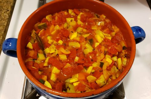 Pot of ratatouille simmering on the stove.