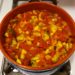 Pot of ratatouille simmering on the stove.
