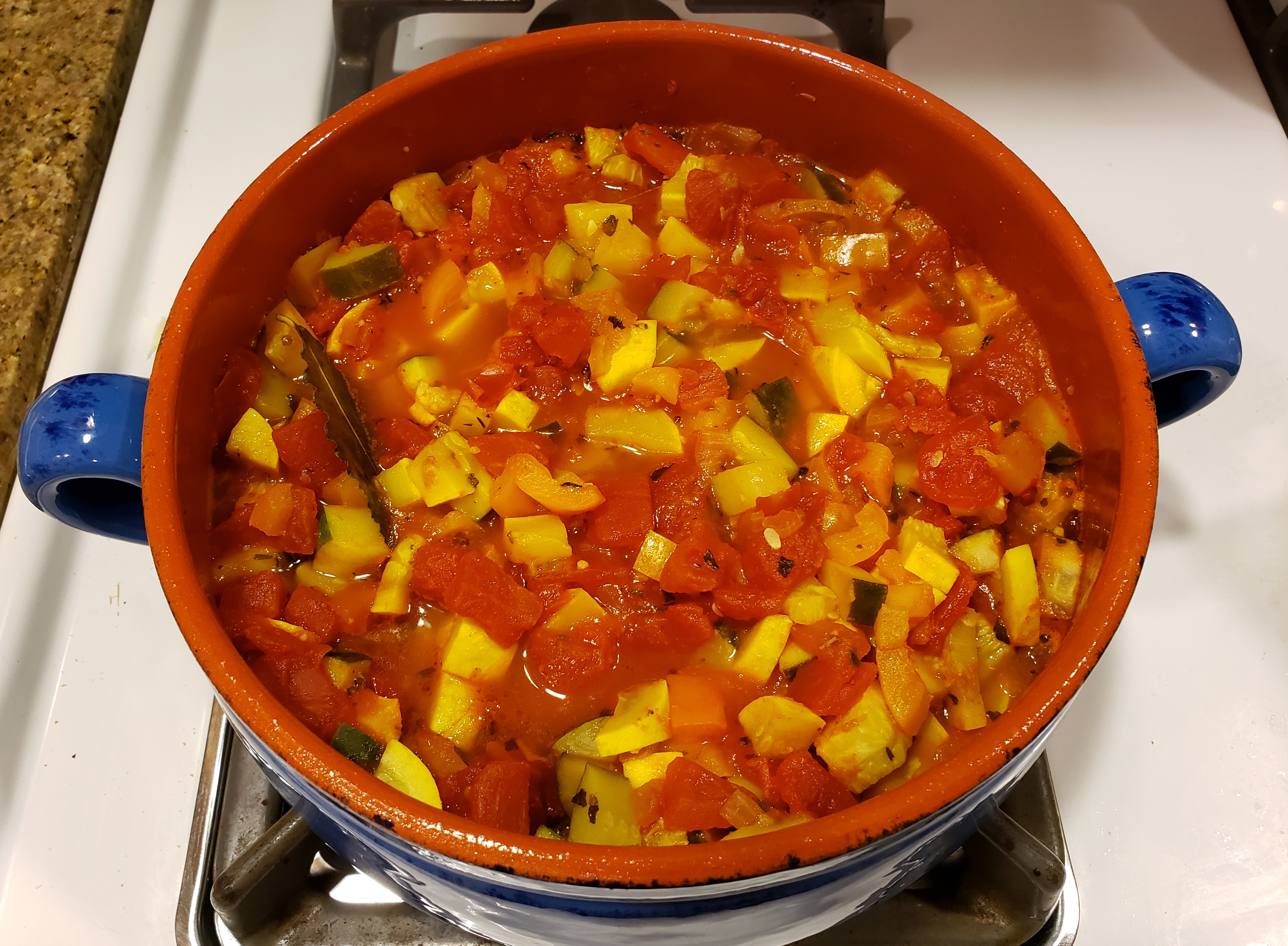 Pot of ratatouille simmering on the stove.