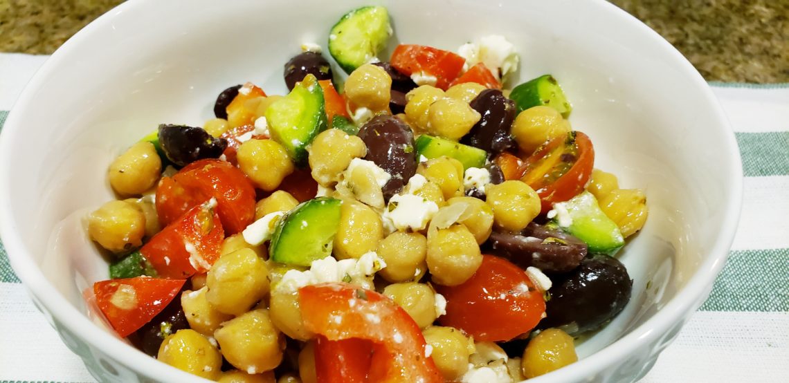 Garbanzo been salad with fresh veggies and Feta cheese.