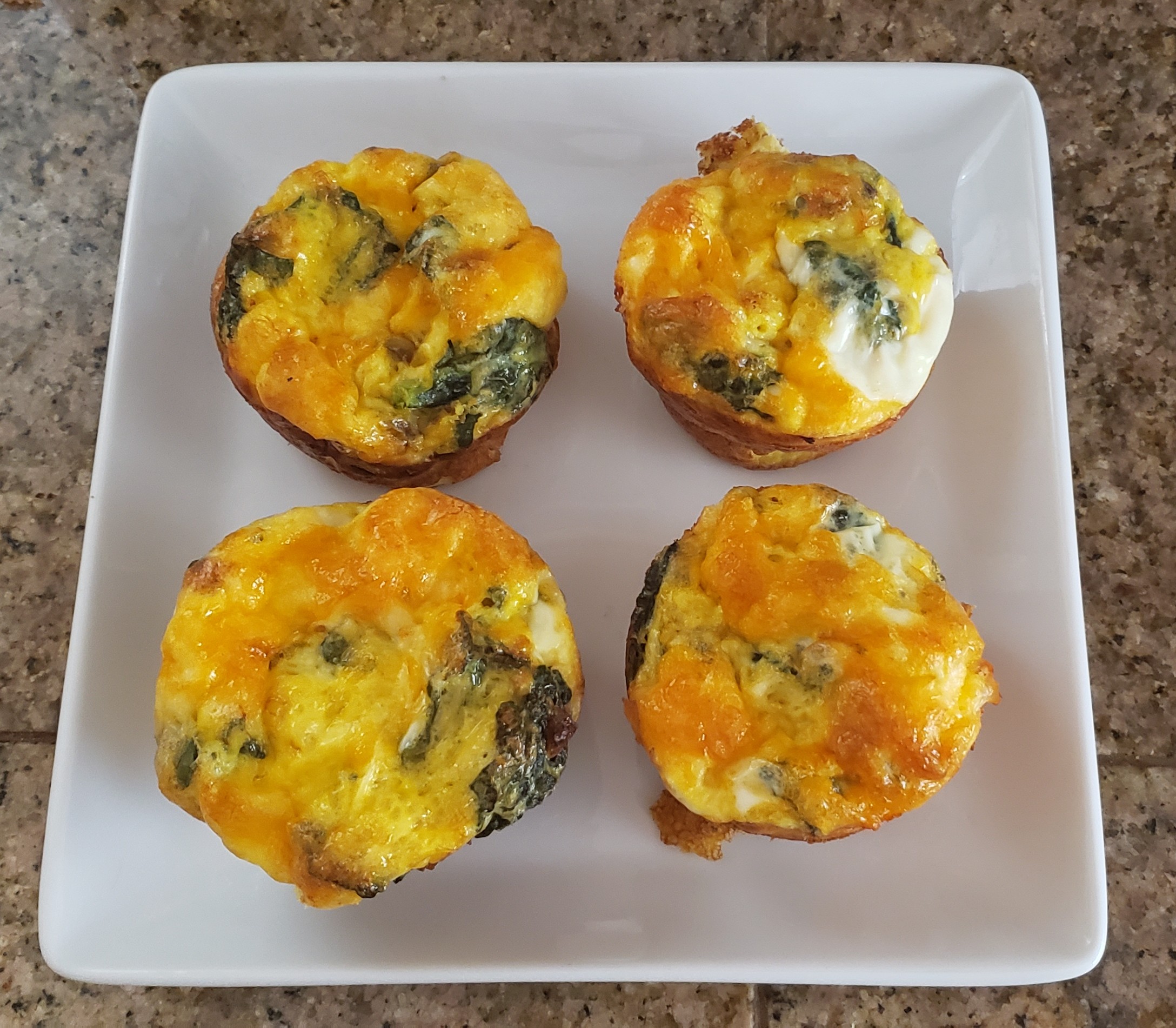 Four cooked egg muffins.